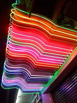 photo of colorful neon lights above a storefront