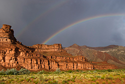 photo of rainbows over desert