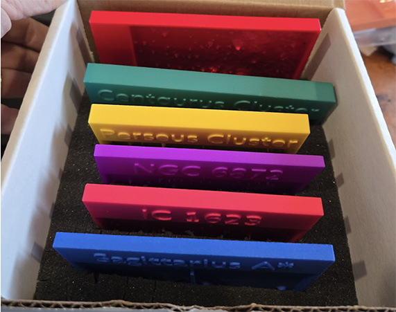 6 tactile plates grouped thematically in a small box